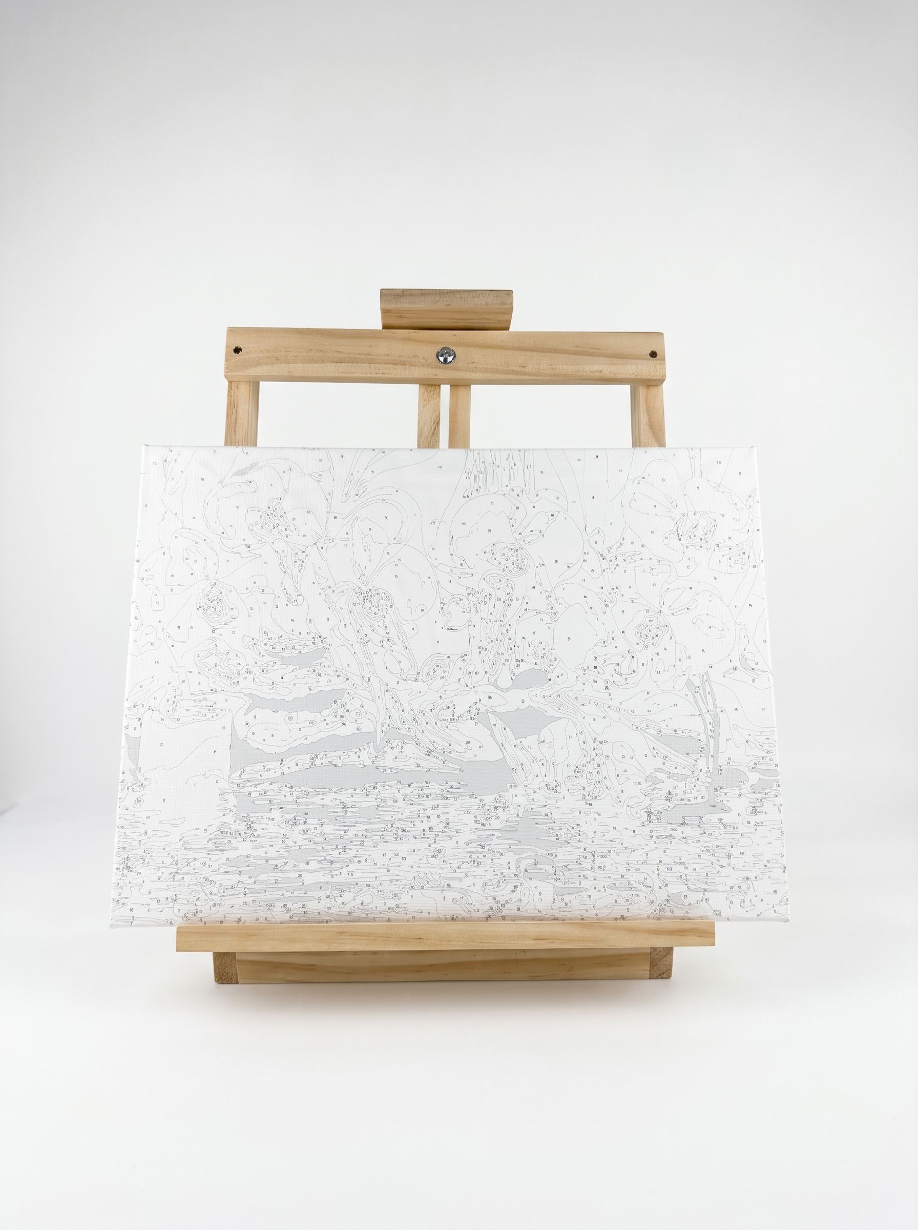 Obraz 40 × 30 cm w poziomie na sztaludze stołowej, oparty o ramę bez górnego uchwytu